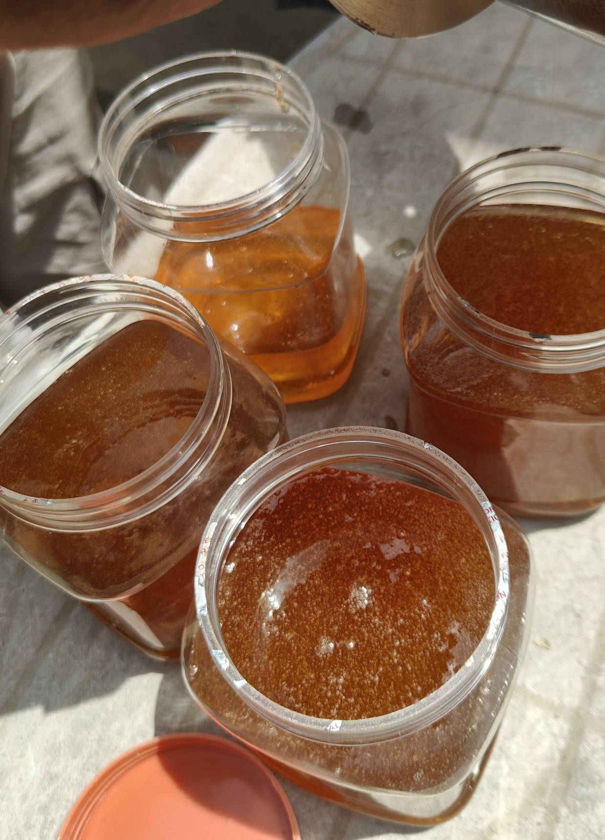 Macro shot of golden honey flowing